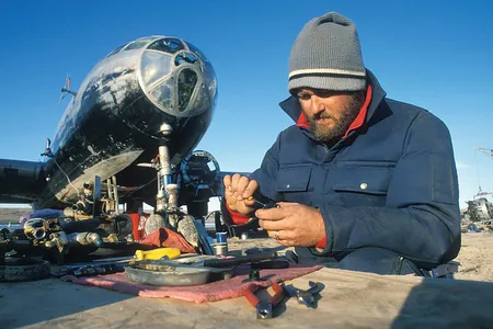 In this 1994 photo, the author rebuilds the B-29’s cowl flap motors. After many repairs made over a period of three years, the old warbird was destroyed in a fire.