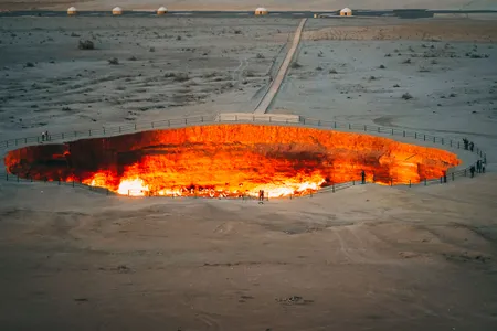 A popular tourist site, Turkmenistan's Darvasa crater pit has been burning gas for over 50 years. The country's attempts to put out its flames have been unsuccessful.&nbsp;

