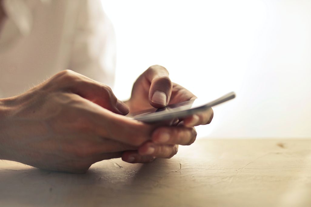 Person's hands and phone