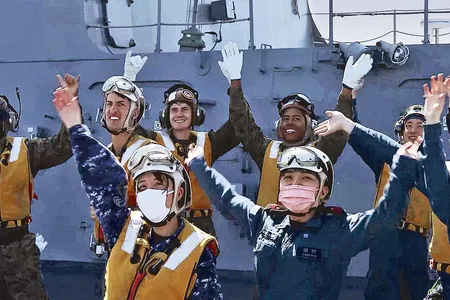 The mood was celebratory aboard the Japanese ship Izumo last October when U.S. Marines landed and took off again. After the cross-deck exercise, Japanese sailors and airmen cheered along with U.S. Marines of Fighter Squadron 242.