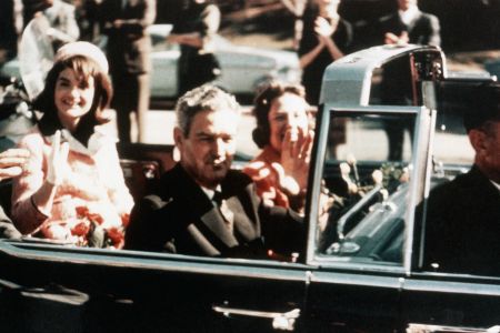 President John F. Kennedy, First Lady Jacqueline Kennedy and Texas Governor John Connally ride through the streets of Dallas, Texas on November 22, 1963, the day of Kennedy’s assassination.