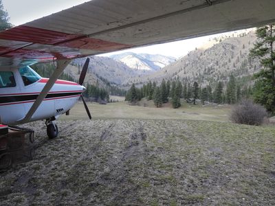 Ahead of the Cessna parked at Central Idaho’s Badley Ranch airstrip, the peaceful canyon doesn’t reflect the difficulty of takeoff and landing here. The strip climbs from a 10- to a 17-degree slope.