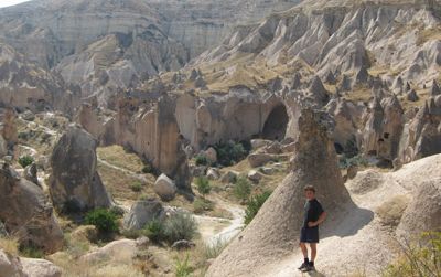The author stands amidst weirdness in the Cappadocian village of Zelve.