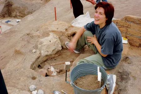 "It's a plastered skull!" shouted anthropologist Basak Boz (with the artifact). To researchers, who have documented more than 400 human burials at Catalhoyuk, the find is evidence of a prehistoric artistic and spiritual awakening.