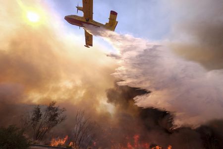 One of precious few purpose-built firefighting airplanes, a Bombardier CL-415 drops water on a fire in Simi Valley, California in November 2018. Over 870,000 acres of California land burned last year, according to Cal Fire.