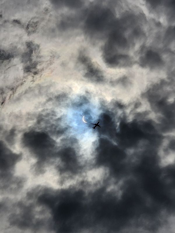 A air plane flying by solar eclipse. thumbnail