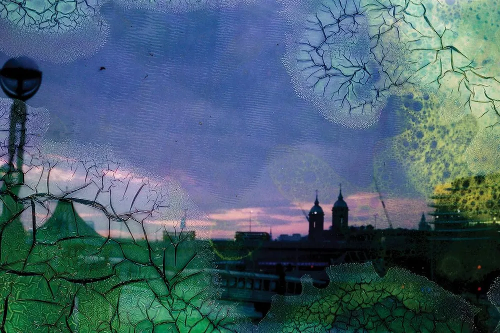 OPENER - When I felt strong enough to go out for a walk, out of desperation from being locked up in the flat, I would walk along the Thames on the large promenade that borders the river. It was a cool night in April, and the sun had left a searing purple 