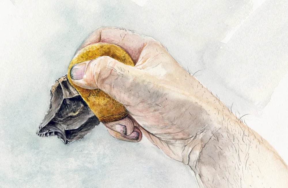 An artist's color illustration of a human hand holding a stone tool, with a handle made from ochre and bitumen
