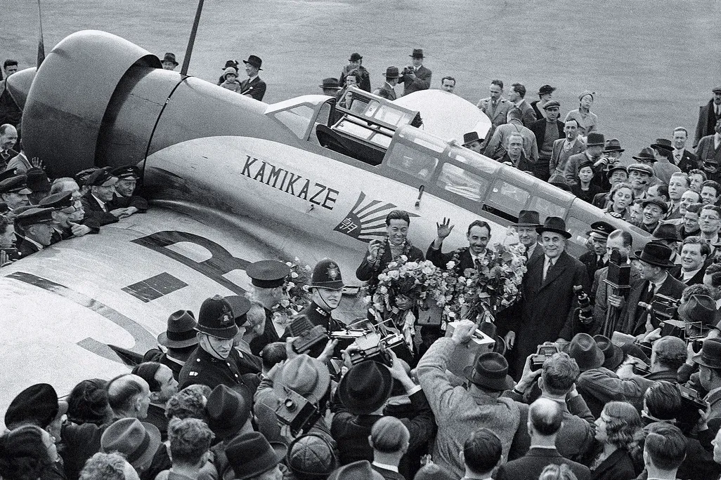 crowd surrounding Japanese airmen