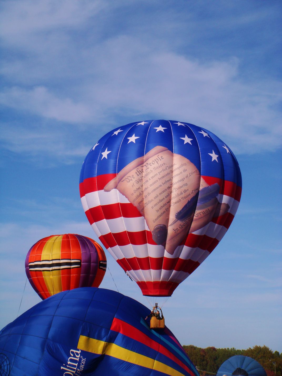 Balloons over Anderson, SC balloon rally. The crowd cheers as the