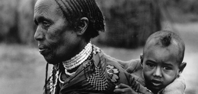 A grandmother in Ethiopia carries her grandchild.