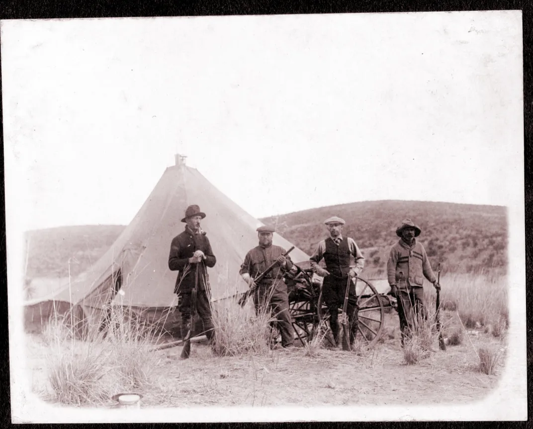 Sam and his friends pose next to their camp in Chihuahua, Mexico