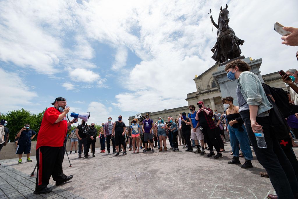 Protesters gather around statue of St. Louis