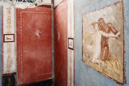 One fresco depicts a satyr and a nymph embracing.