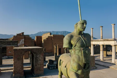 In a 21st-century tribute to antiquity, bronze sculptures by the late Igor Mitoraj, including this centaur, grace the public grounds of the archaeological site.