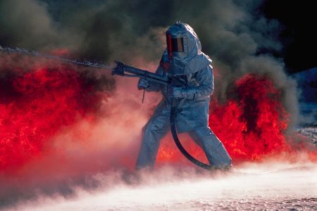 Aluminized suits are used to reflect heat at the Armed Forces Firefighting School. Chanute Field, Illinois, in 1977.
