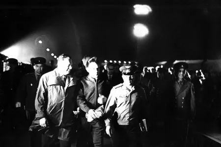 Yuri Gagarin (in cap) accompanies Vladimir Komarov (to his right) on the walk to the launch pad, early on the morning of April 23, 1967.