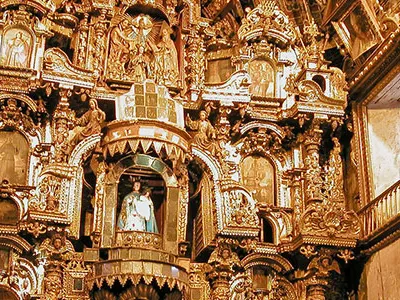 Inside the church of San Pedro Apóstol is an ornate gold-leaf altar—earning it the moniker of "The Sistine Chapel of the Andes."