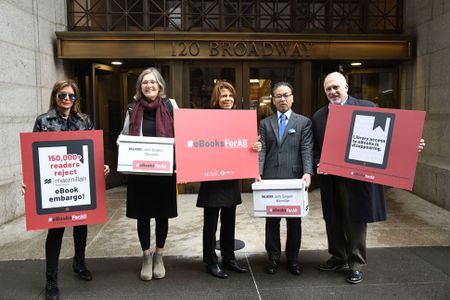 Representatives of the American Library Association deliver a petition protesting new e-book limitations to Macmillan Publishers.
