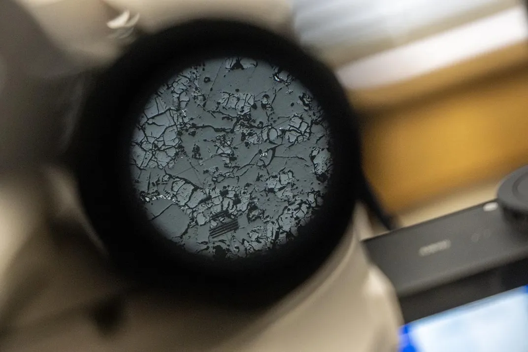 a gray and black composition seen through a microscope