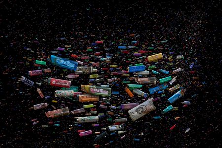Single-use cigarette lighters, collected by Mandy Barker, represent our transition to a consumerist, throw-away society.