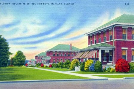 A vintage postcard presents a deceptively sunny view of the school