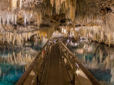 Stalactites reflect in the water at Crystal Caves in Bermuda.
