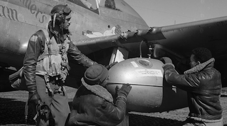 Learn more about the stories of the Tuskegee Airmen. Edward C. Gleed and two unidentified airmen, 1945. Photo by Toni Frissell.