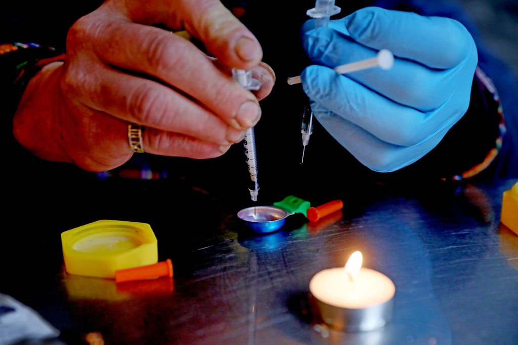 A person holding needles