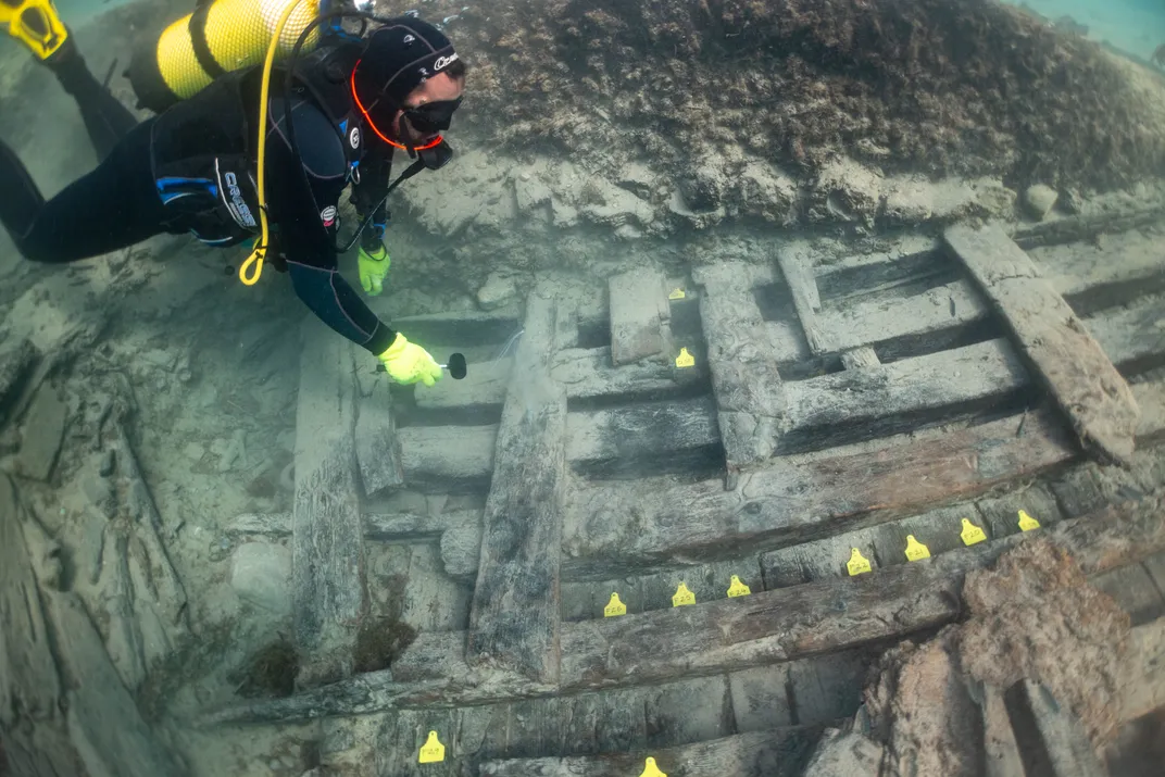 PhD student Aymar Maluenda marks hull planks and frames on one of the shipwrecks.