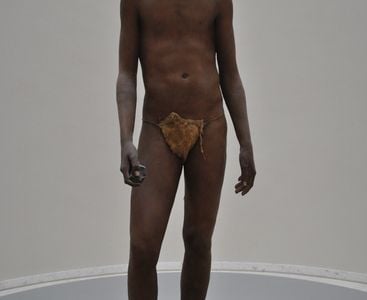 A reconstruction of Homo erectus, the first hominid to reach a modern height.