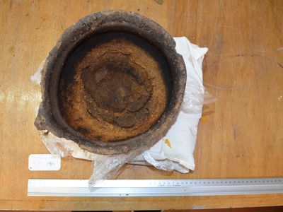 A 3,000-year-old clay pot with cheese residue found burnt to the bottom.