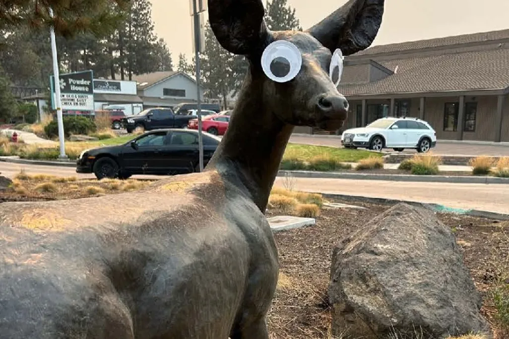 Sculpture of a deer with googly eyes