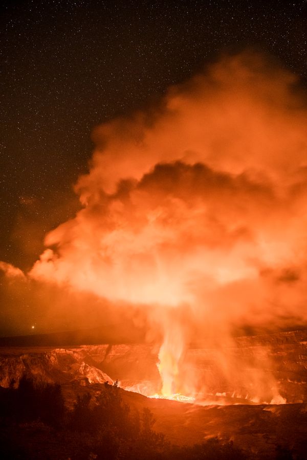 Lava erupting from Kilauea on Big Island under stars thumbnail