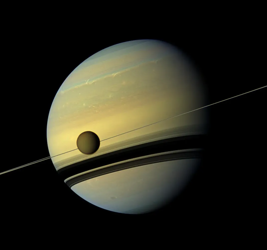 Titan, Saturn's largest moon, passes in front of Saturn