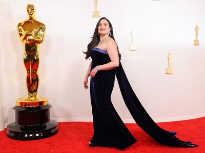Lily Gladstone poses on the red carpet at the Academy Awards in March 2024.

