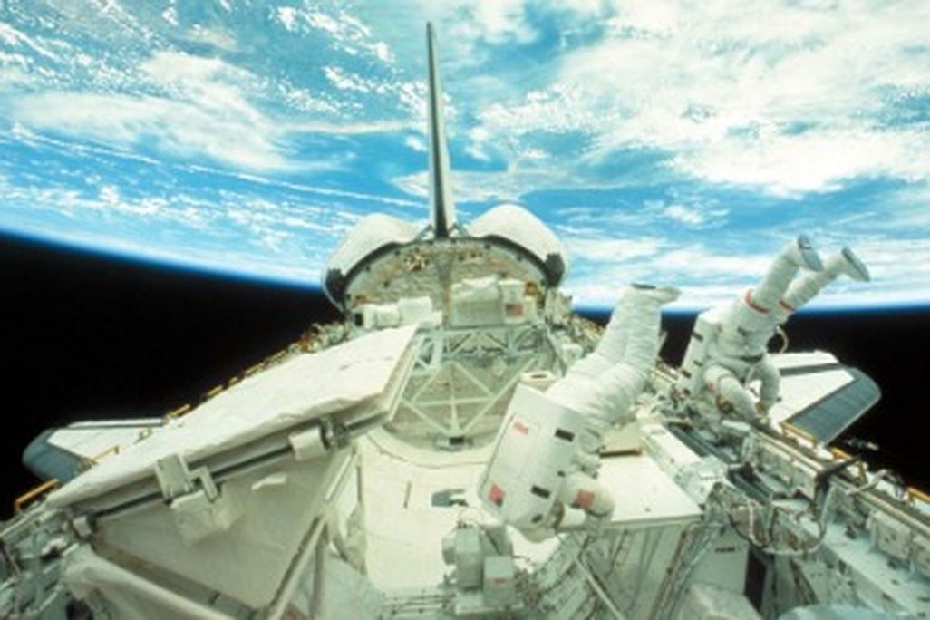 Astronauts float in zero gravity outside the Challenger space shuttle in 1984.