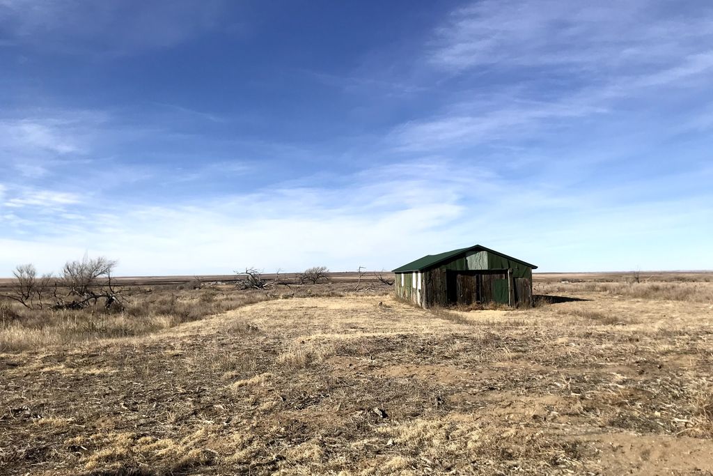 Old green building at the site of the former Granada Relocation Center in Colorado
