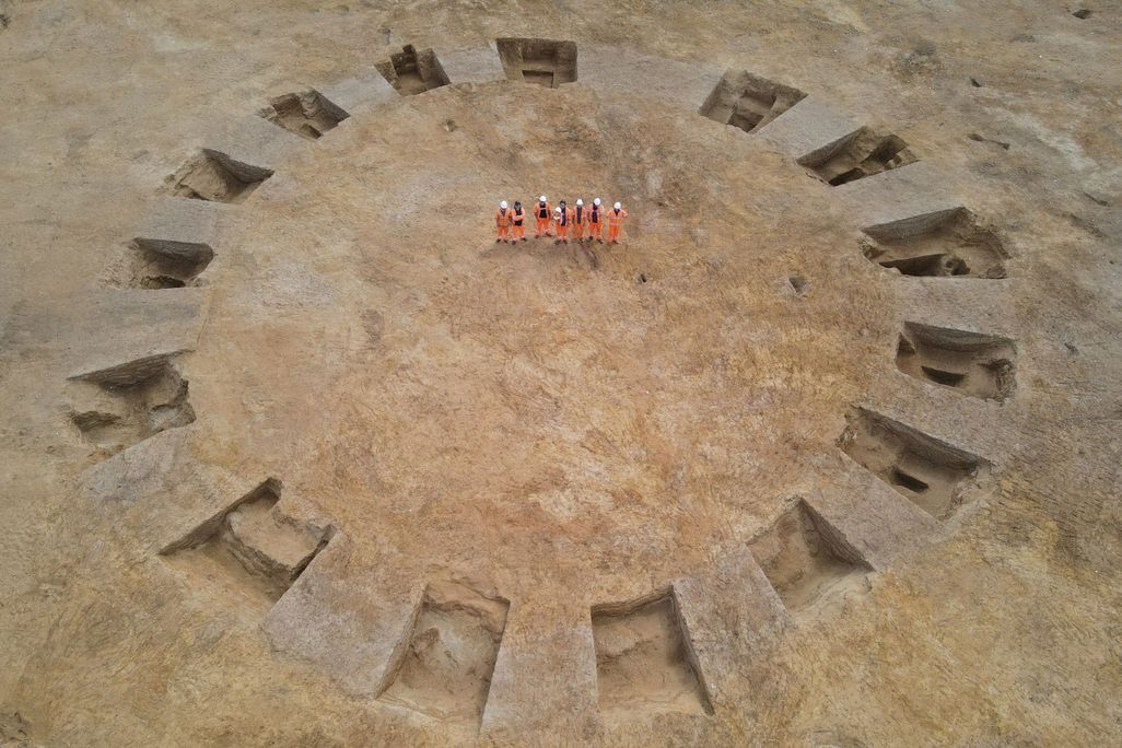 Archaeologists in a barrow, or prehistoric burial mound, in Norfolk, England