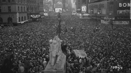 A crowd gathers in Times Square in 1945. Since then, we’ve added a few more people to the population.