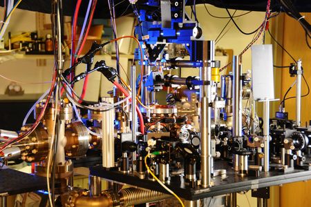 This is an atomic clock that uses the predictable frequency of ytterbium atoms absorbing and emitting light to tell time. A new experiment paired a ytterbium-based atomic clock with two others that used aluminum and strontium atoms, respectively, to create an even more accurate measure of time. 

