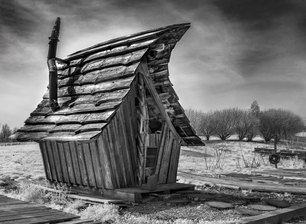 "make yourself at home, why don't ya"
This ol' shack has seen better days, but it still stands and serves a purpose.
It is actually a small lending library, filled with books, as filled as it could be, 
that is...this is an Infrared Photograph.