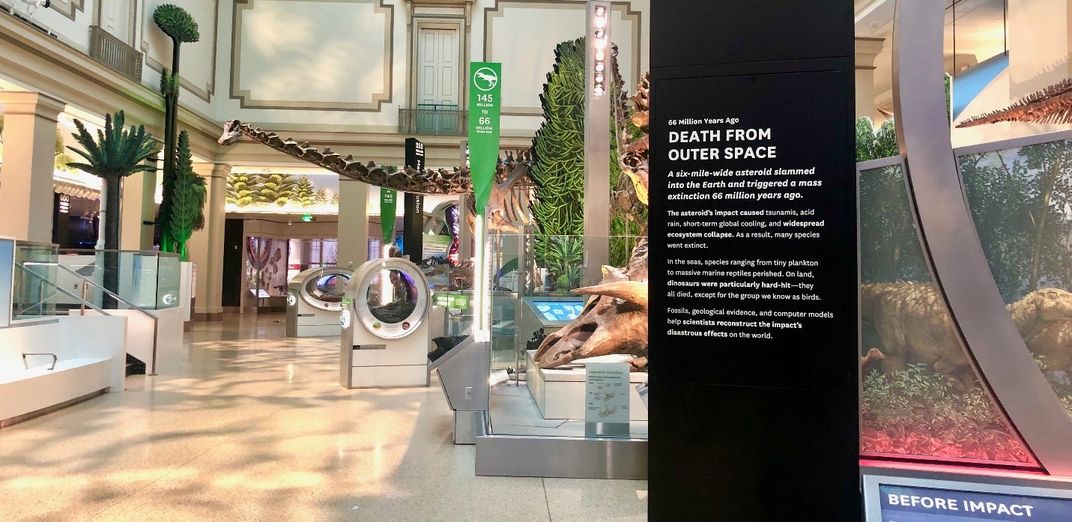 "Death From Outer Space" in white on a black sign in the Smithsonian's new fossil hall.