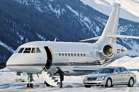 A Dassault Falcon 2000, a Maybach luxury auto, and freshly swept stairs: NetJets set up this publicity shot in Switzerland, but for fractional jet owners, such fantasy is the reality.