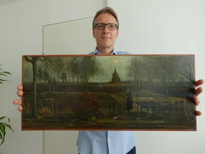 Arthur Brand poses with The Parsonage Garden at Nuenen in Spring, painted by Vincent van Gogh in 1884.