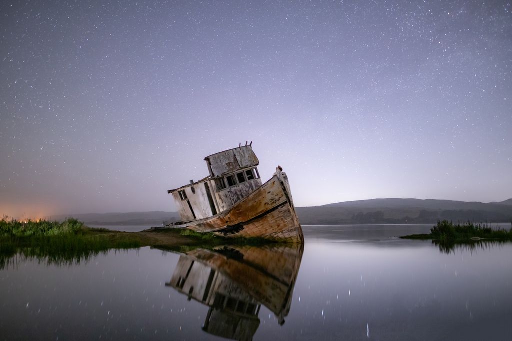 Beached ship against night's sky