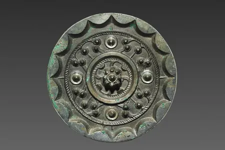 Bronze mirrors like the one pictured here were luxury items in Han dynasty China. Researchers recently discovered a trove of 80 ancient mirrors at a cemetery in Shaanxi Province.