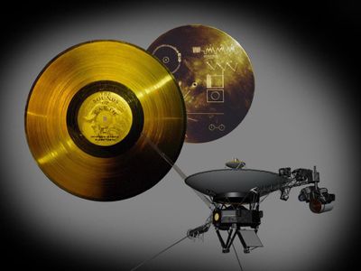 The Golden Record, shown here with its cover that has instructions on how to play it (upper right), was carried on Voyager in the section indicated with the yellow circle on this artist's impression. 
