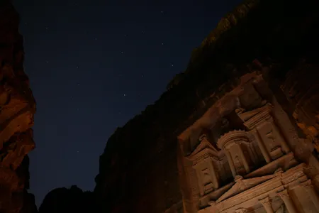 A long exposure of the Treasury at night illuminated by candlelight