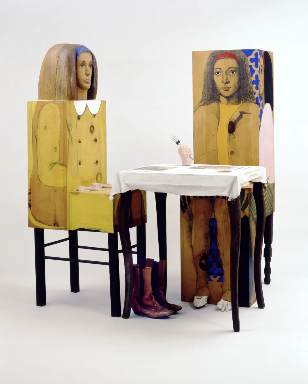 Marisol's Dinner Date, a wooden sculpture of two women at a table